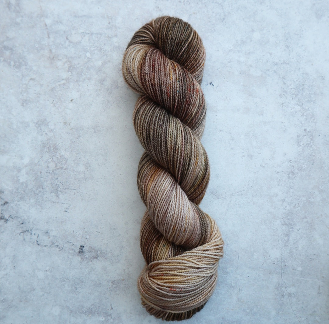 Yarn in grays, greens and golds.