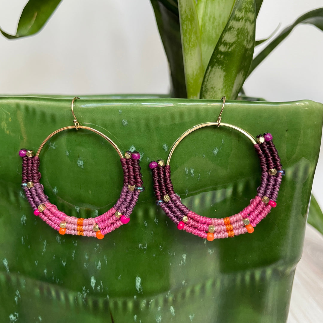 Macrame and beaded earrings in purple, pink and orange.