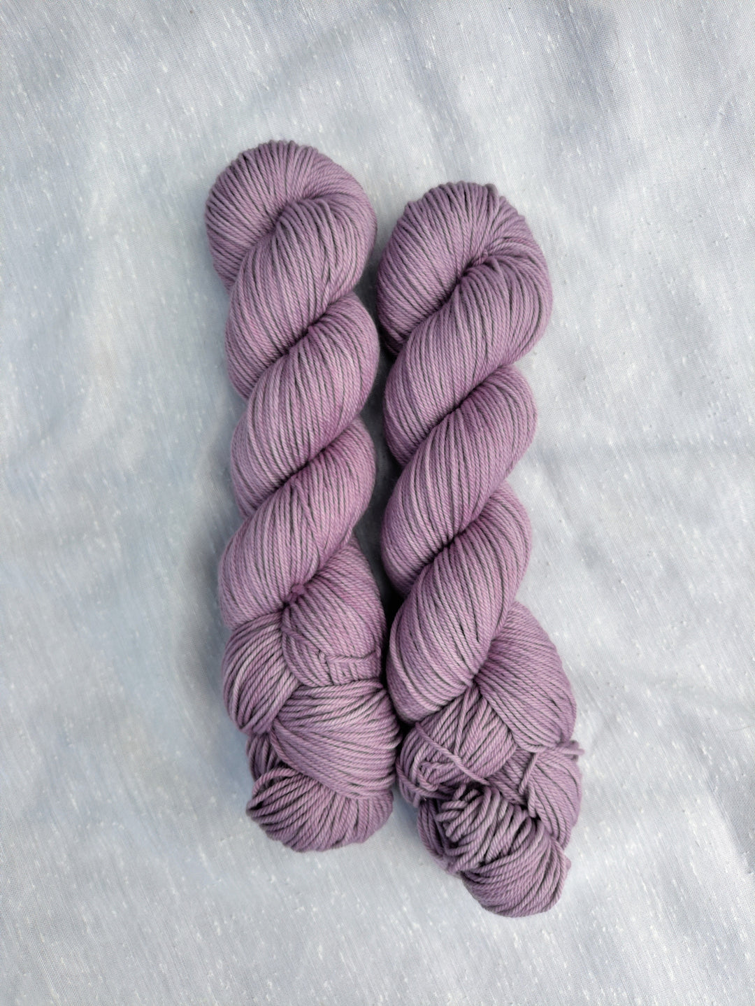 Pale purple semisolid yarn.