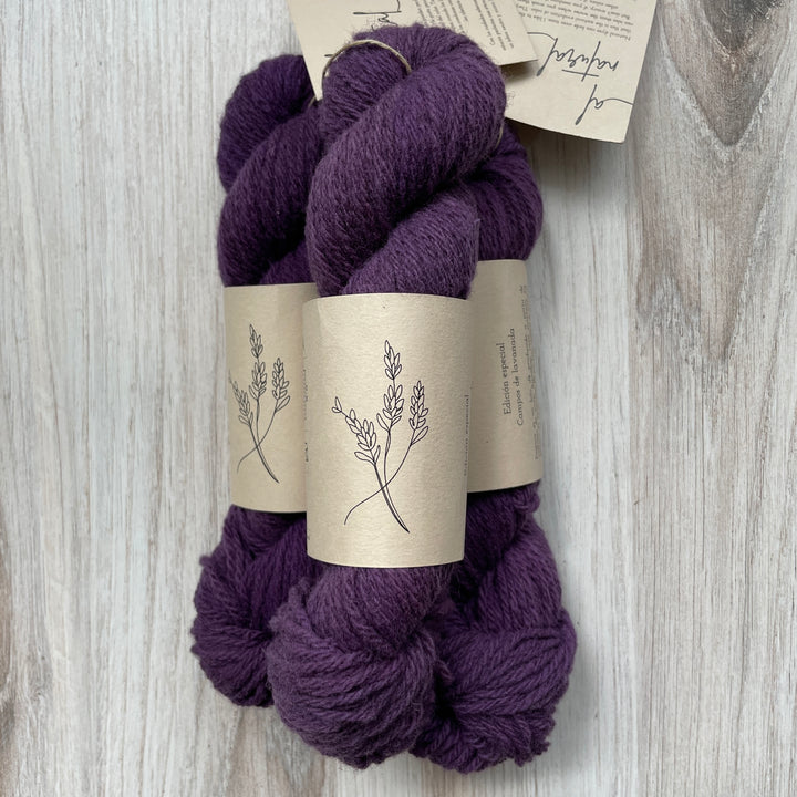 Purple yarn with a brown label with an illustration of a lavender plant.