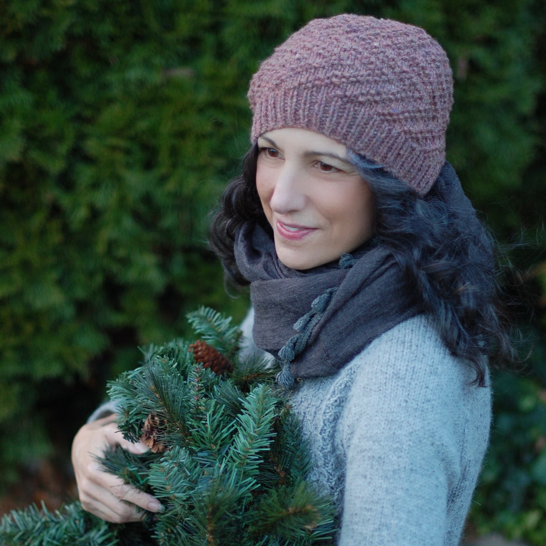 A light purplr hat with a zig zag pattern.