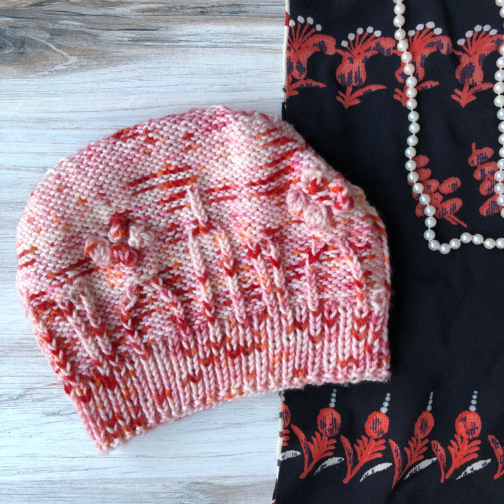 A red and orange speckled hat.