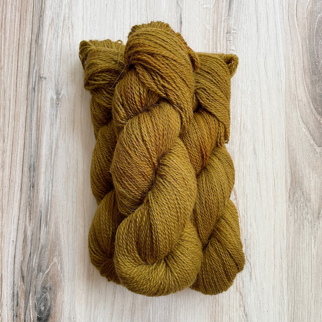 Brownish green yarn.