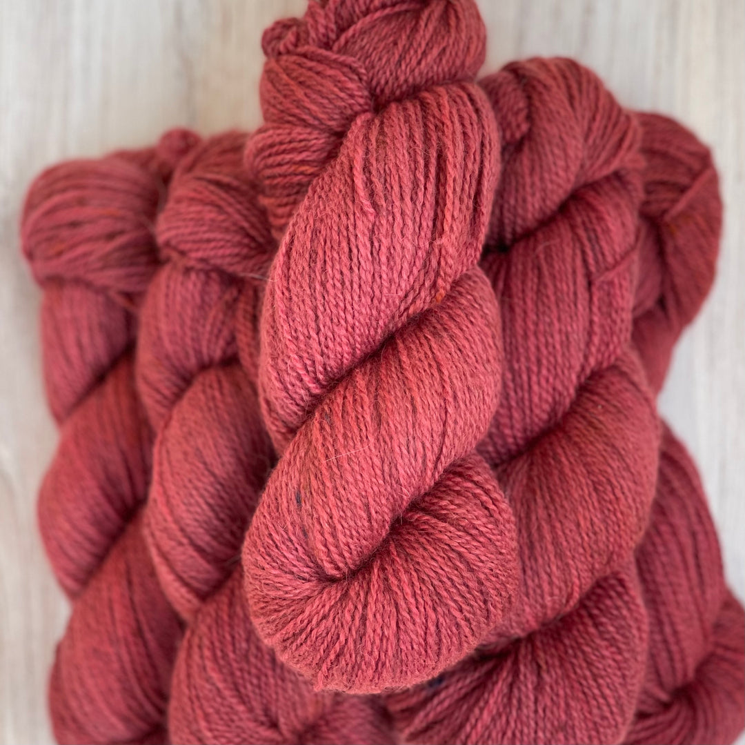 Skeins of deep pink yarn.