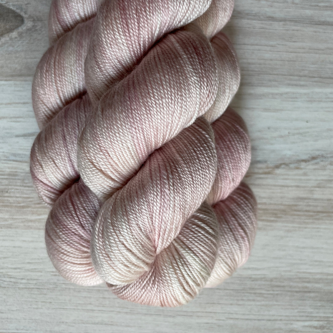 Pale pink yarn.