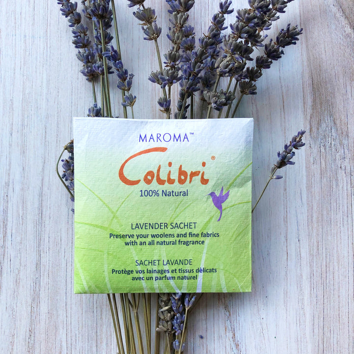 A green lavender sachet above sprigs of lavender.