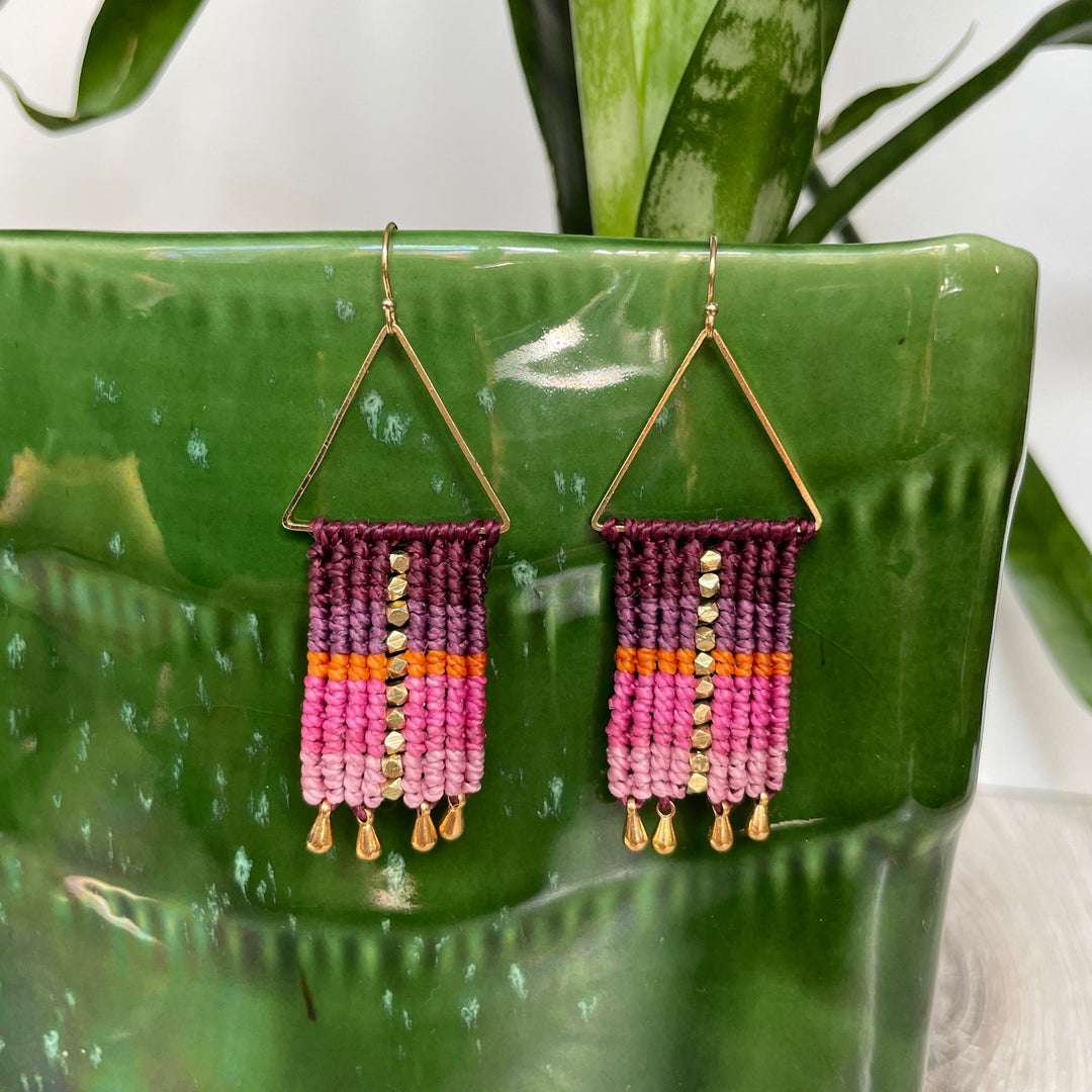 Macrame and beaded earrings in purple, pink and orange.
