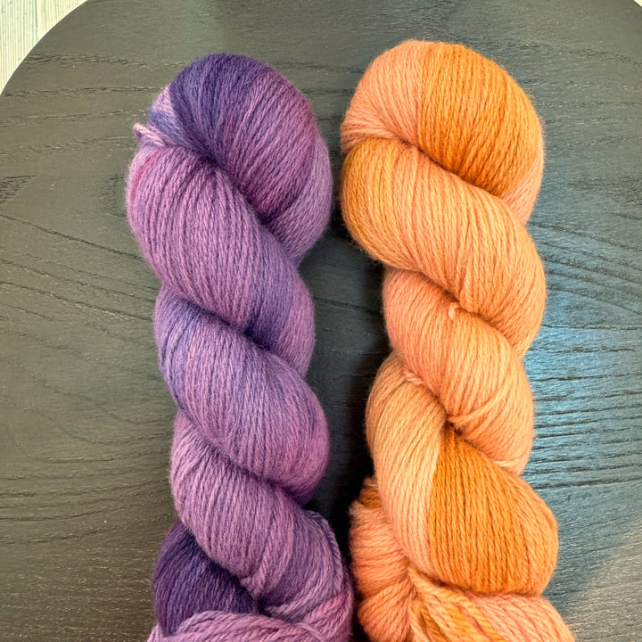 Skeins of purple and orange yarn.