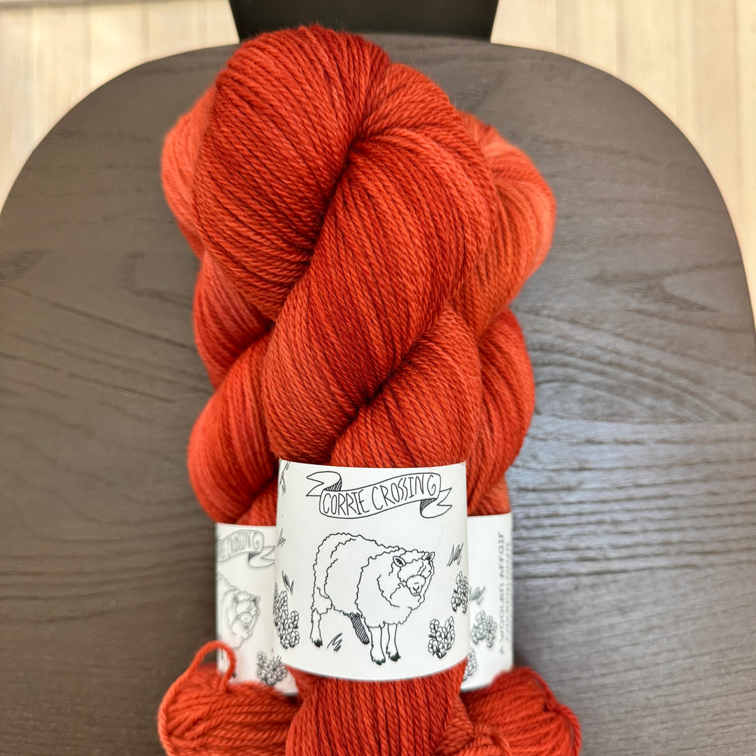 Skeins of orange yarn.