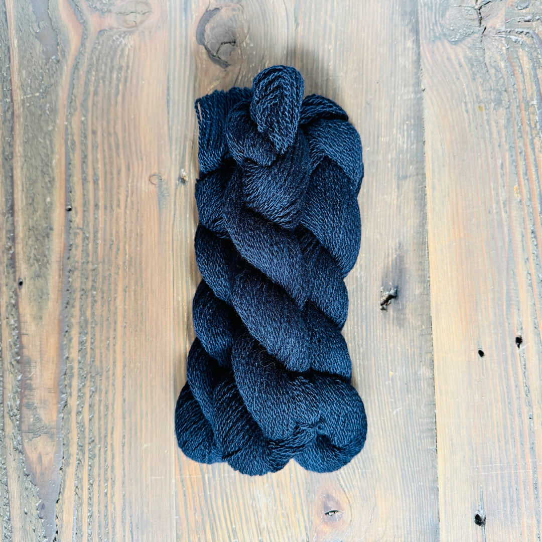 Skeins of dark blue yarn.
