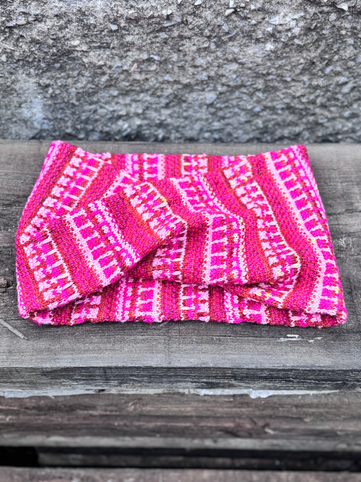 A pink, fuchsia and orange colorwork cowl.