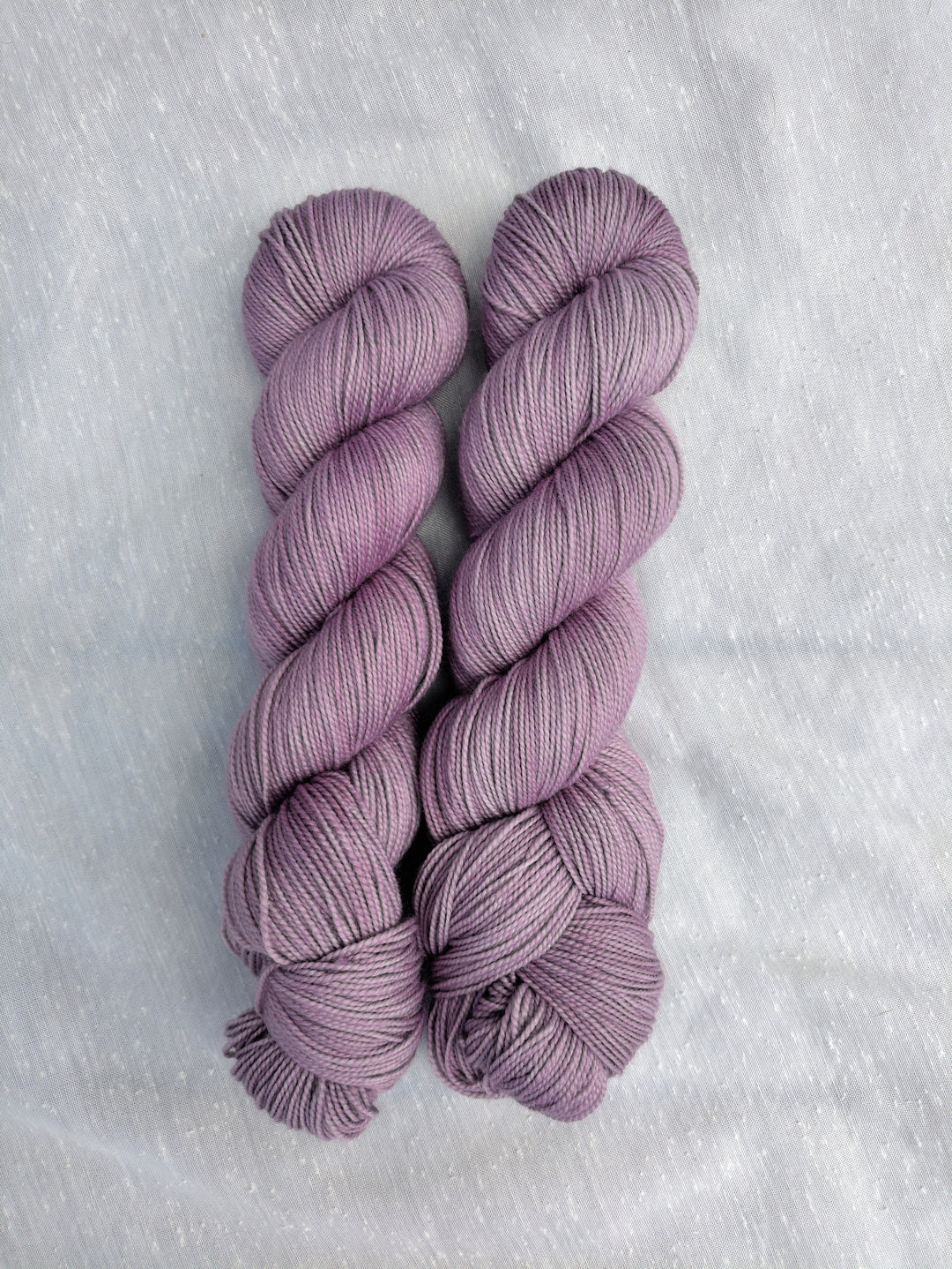 Pale purple semisolid yarn.