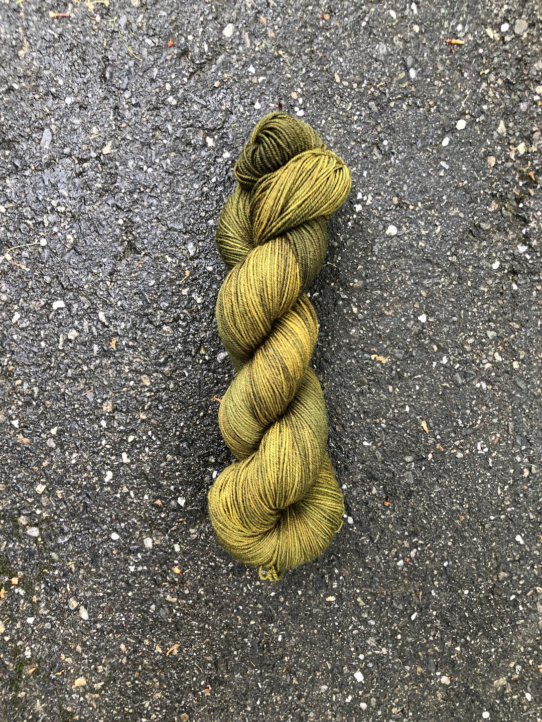 A skein of mossy green yarn.