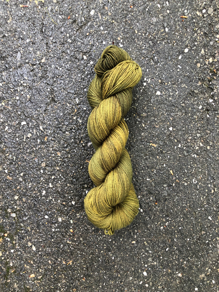 A skein of mossy green yarn.