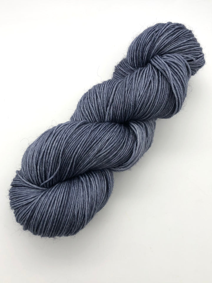 A skein of blue gray yarn.