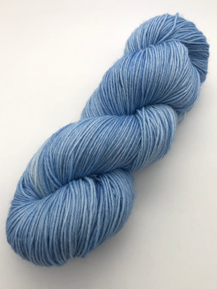 A skein of light blue yarn.