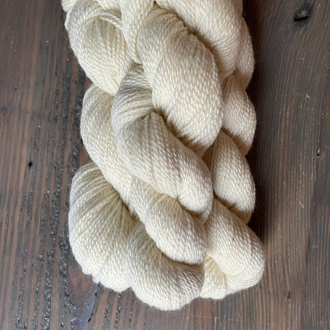 Skeins of cream yarn.