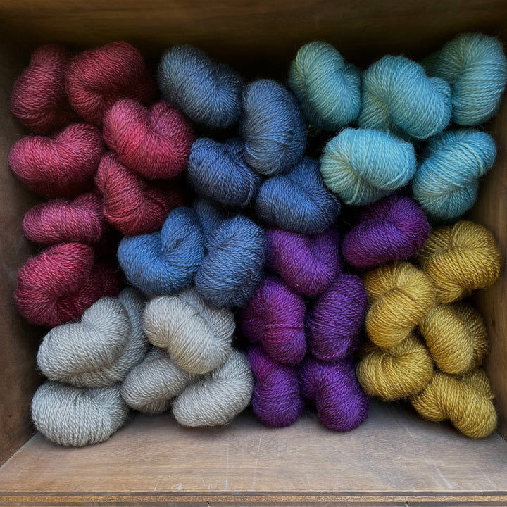 Colorful yarn in a cube.
