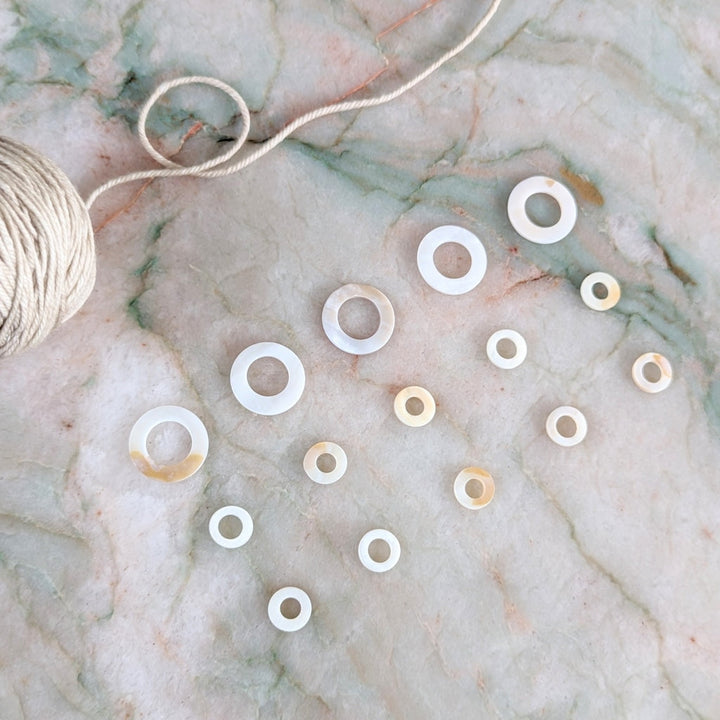 A set of 15 seashell stitch markers. 