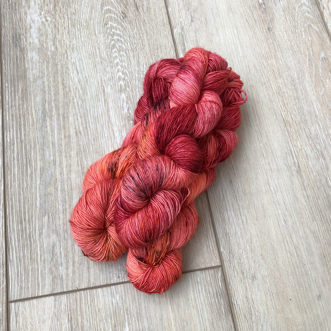 Skeins of pink orange yarn.