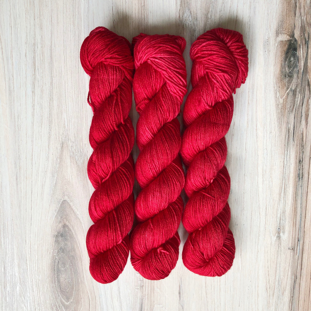 Skeins of bright red yarn.