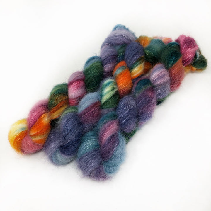 Purple, orange and green fuzzy yarn.