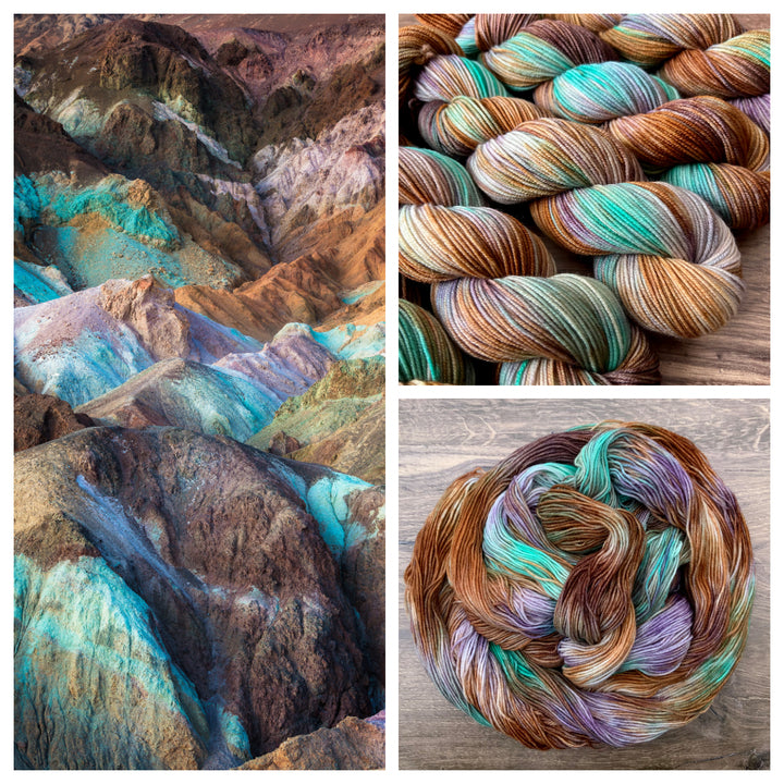 Mountaintops splashed with blue, purple, pink orange and teal colors and skeins of yarn that mirror those colors.