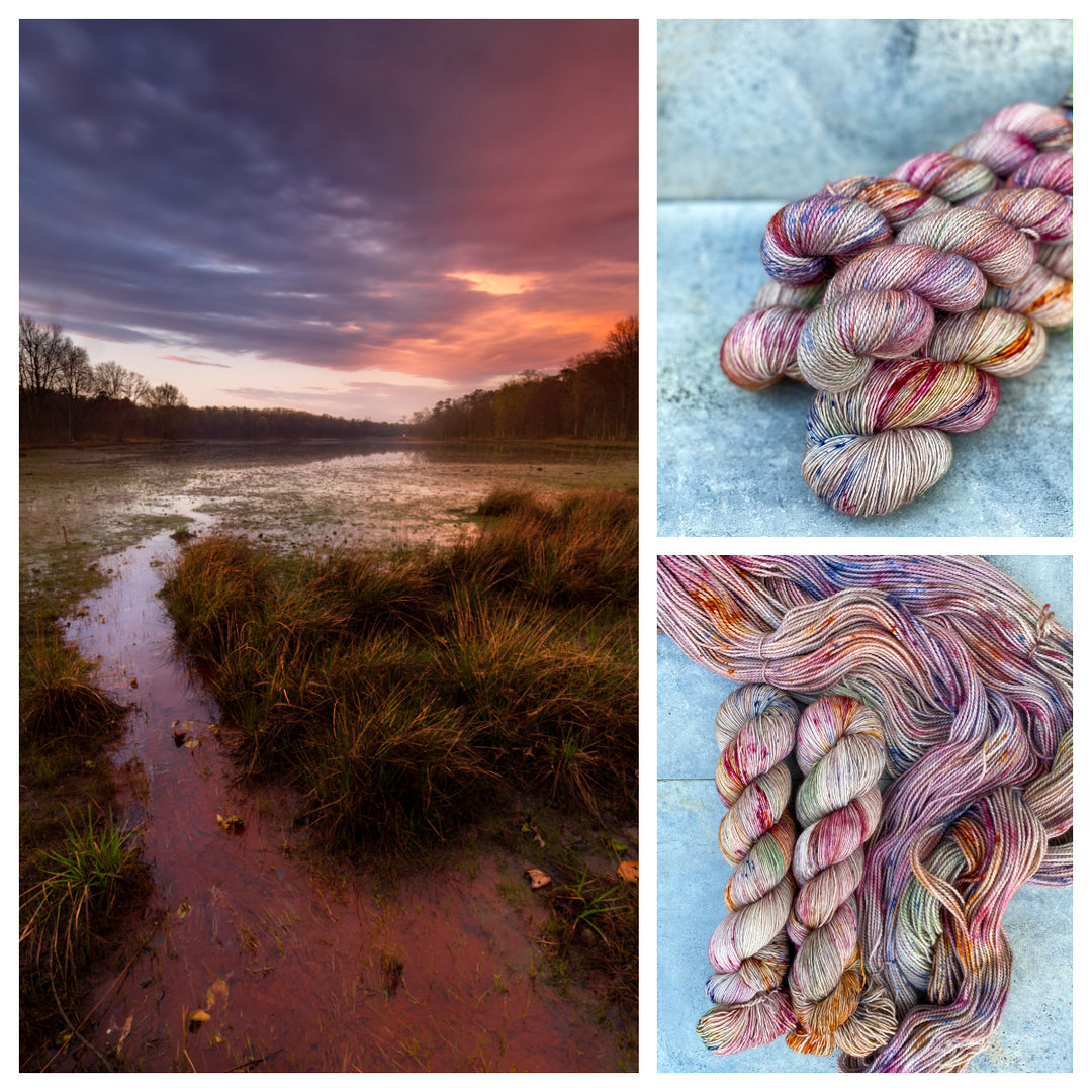 A marshy area under a pink sunset, with pink, green and gold speckled yarn.  