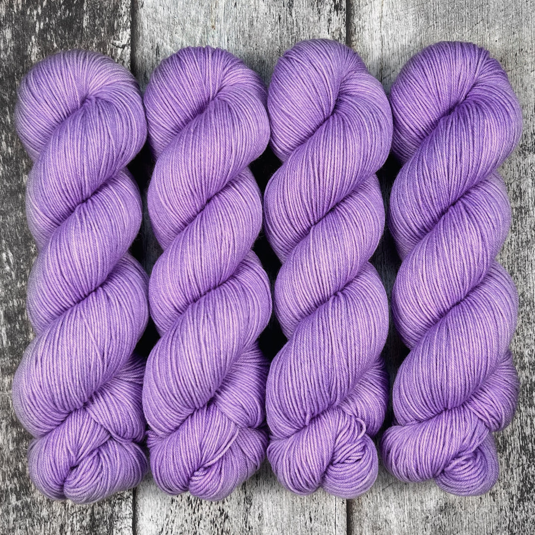 Skeins of lilac yarn.