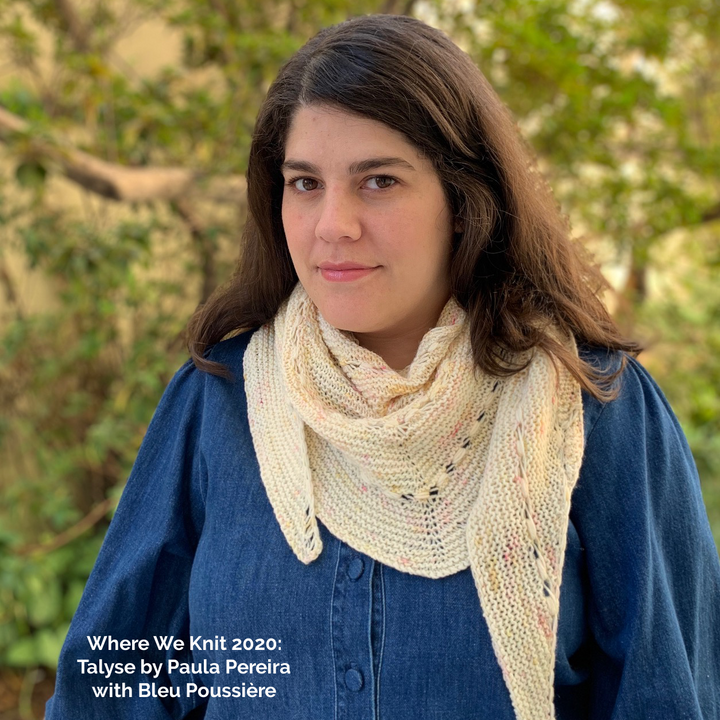 A woman wears a cream colored speckled shawl and the words Where We Knit 2020 Talyse by Paul Pereira with Bleu Poussiere. 