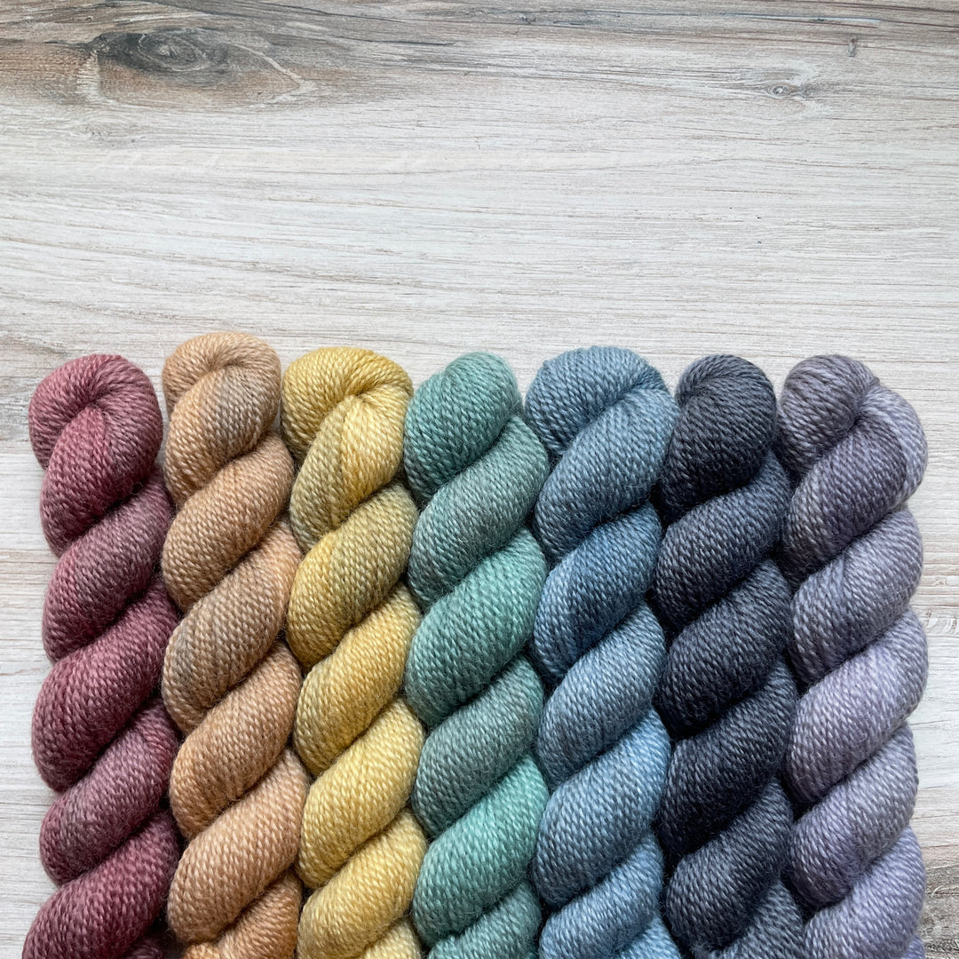 A rainbow of mini skeins of yarn.